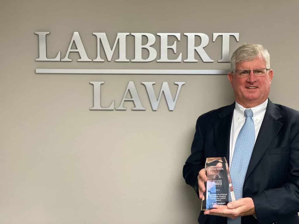 Brad Lambert with Award