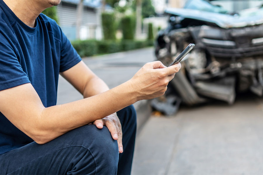 Man on Phone After Car Accident